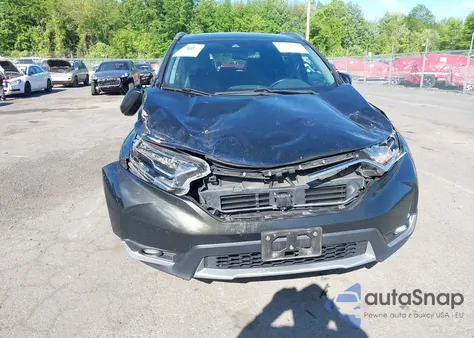 2018 Honda Cr-V Touring z USA, uszkodzony, nr VIN 7FARW2H91JE088570